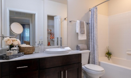 a bathroom with a tub sink and toilet