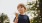 a boy holding an ice cream cone