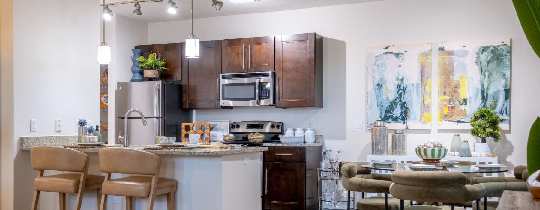 a kitchen with a table and chairs