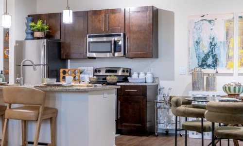 a kitchen with a table and chairs