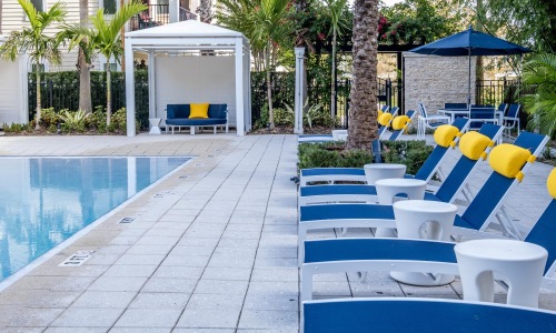 a pool with chairs around it